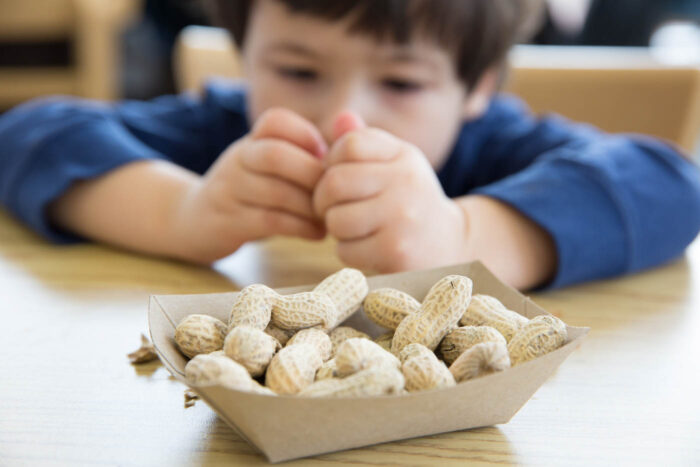 Little Boy Eating Peanuts