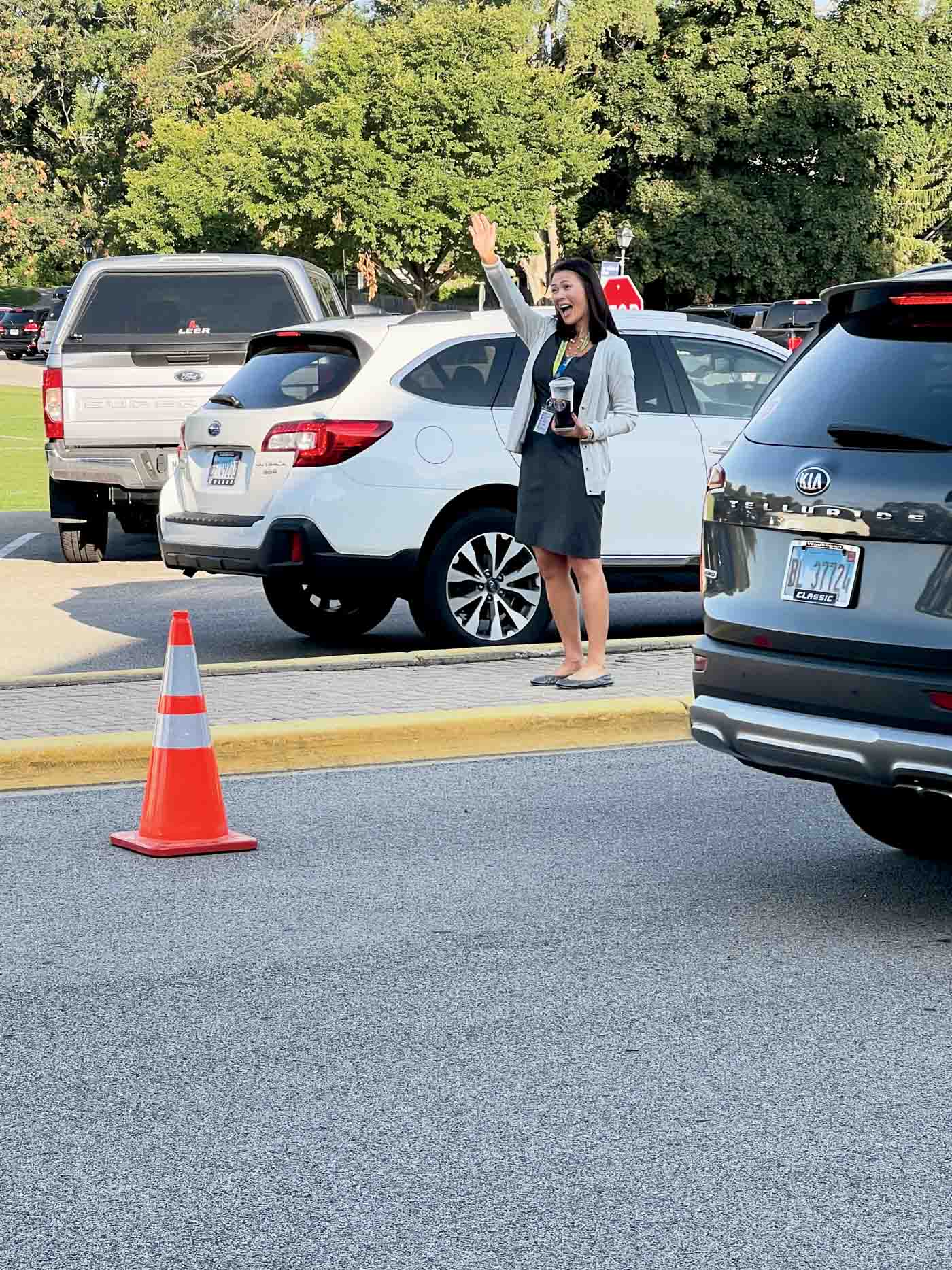 48 *assistant Superintendent And Principal Dr. Erin Lenart Greets Students And Parents With A Smile And A Wave, 