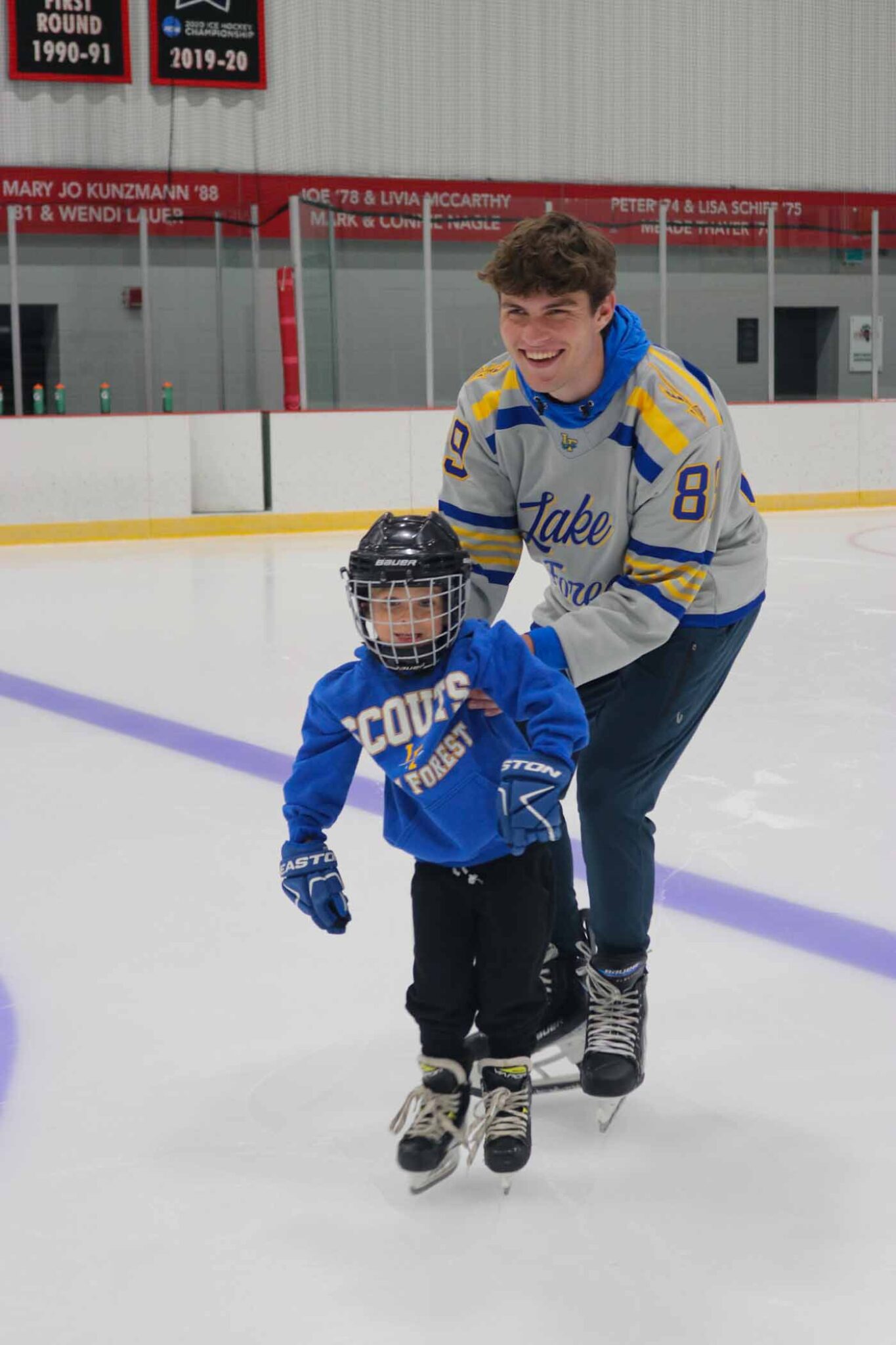 52 Senior Jack Rancourt Teaching A Young Skater. Photograph By Sarah Zaute 