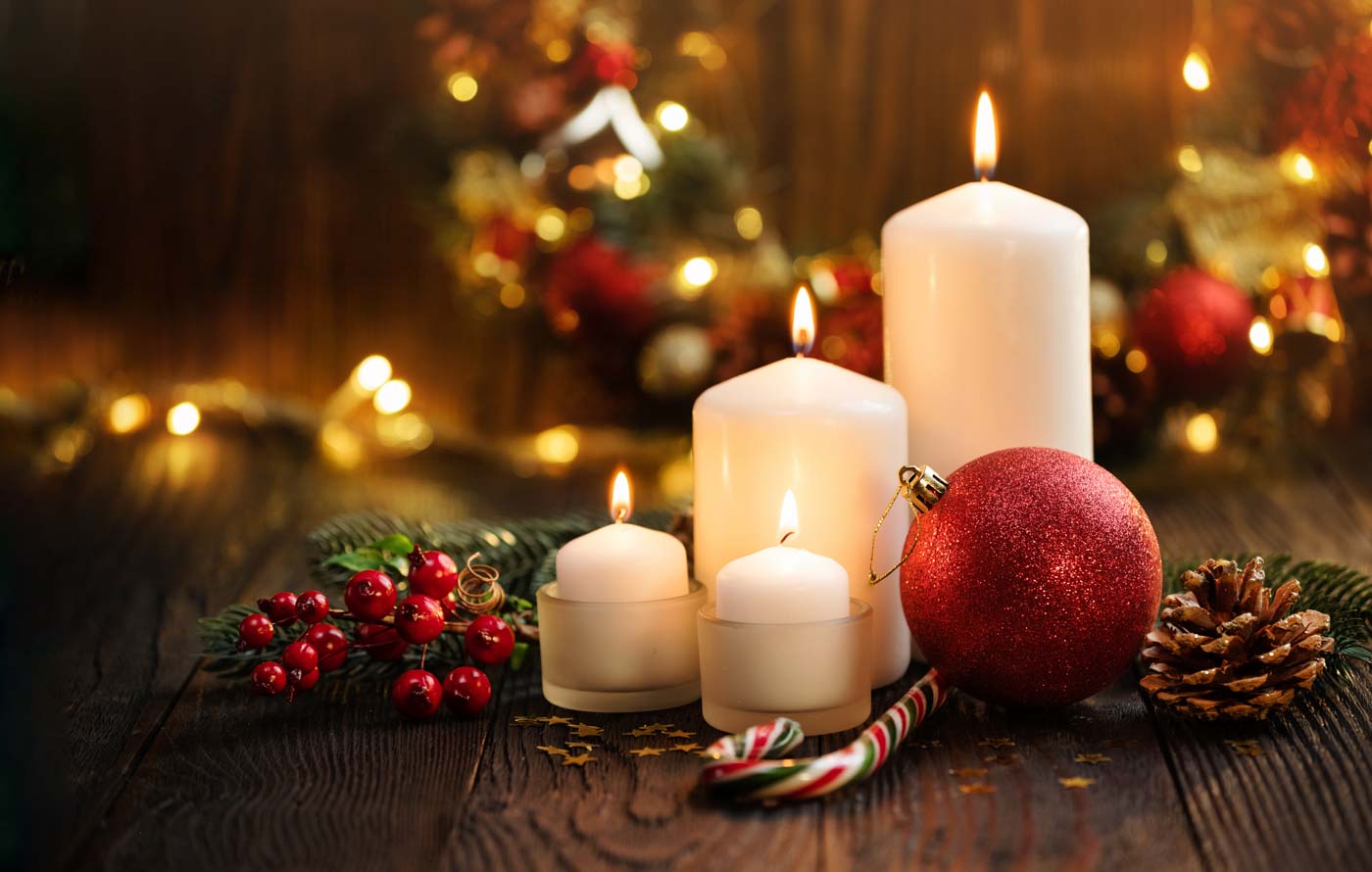 Burning White Christmas Candles And Christmas Decoration On Wooden Background. Marry Christmas Greeting Card