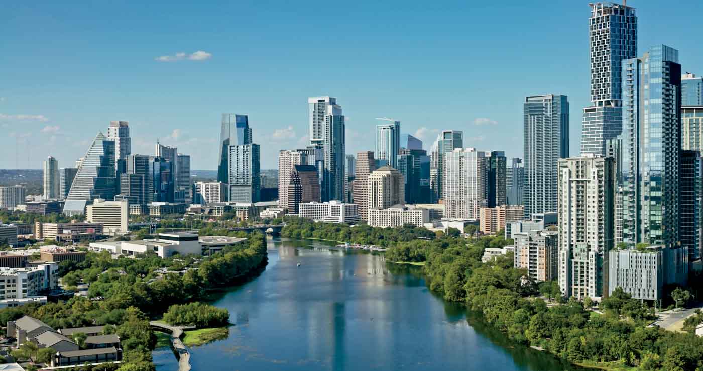 Aerial Shot Of Lady Bird Lake And Downtown Austin, Texas On A Sunny Day