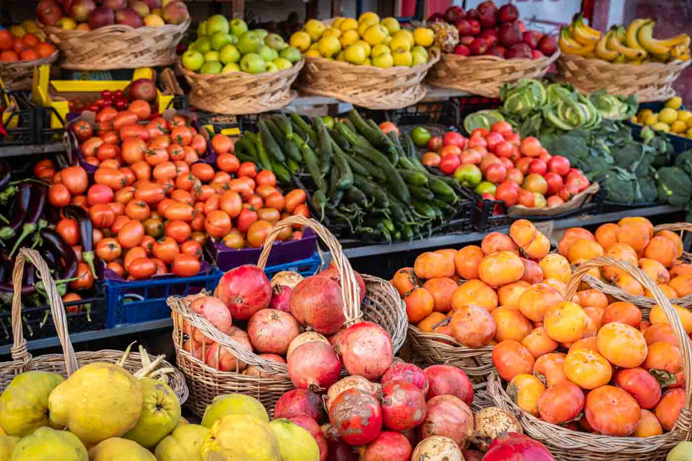 Fresh Market Produce At An Outdoor Farmer's Market. Shop Selling Various Kinds Of Vegetables